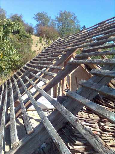 With tiles removed the old batten bowing wood is easier to see. With tiles removed the old batten bowing wood is easier to see.