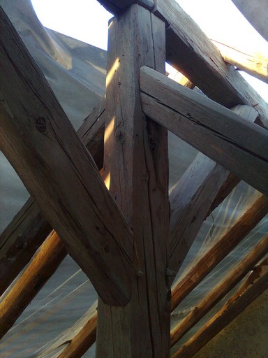 single metal nail. Despite their age, all the massive timbers are in excellent condition and the new roof was laid over them. single metal nail. Despite their age, all the massive timbers are in excellent condition and the new roof was laid over them.