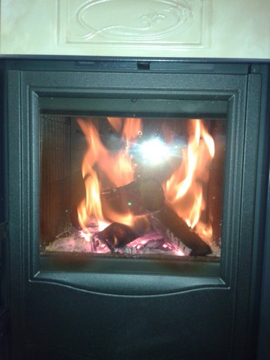 By the wood stove.