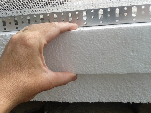 Because of the bricks that made up our wall, we decided to go with an 8 cm (3.15 inch) thick insulation layer.