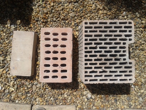 From left to right: normal red brick, old insulating brick, and modern insulating brick.