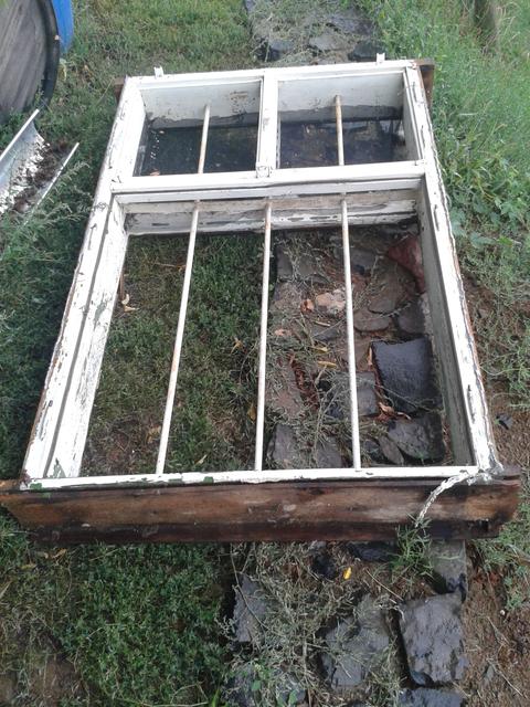 The old window after removal. I have to admit, I will not miss the prison bar look.