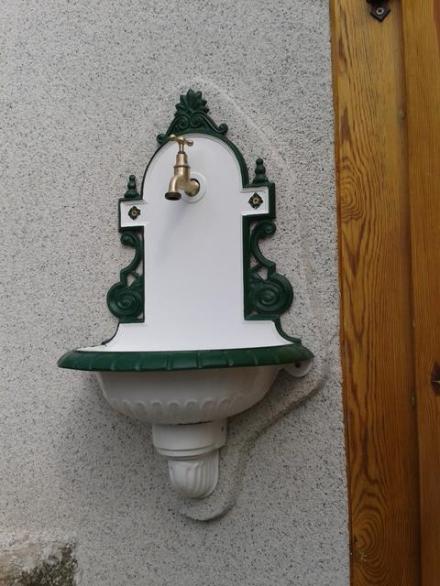 Final result after last outer coat of exterior wall plaster was applied and the garden basin was installed.