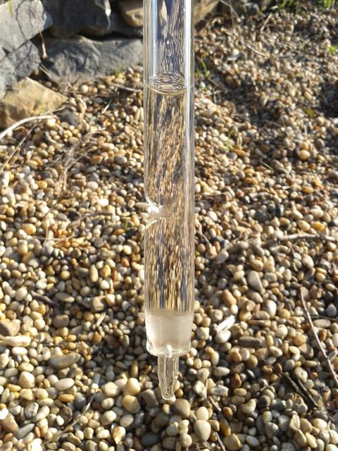 A modern wine thief has a glass stopper at the end to keep the wine inside.