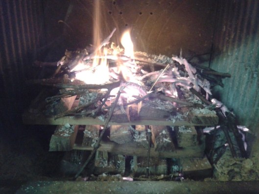 Twigs burnt and the thin wood strips are now starting to burning