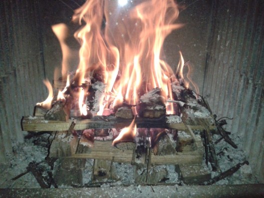 Fire continuing down the layers of wood.