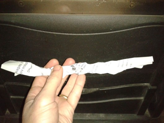 Twist paper into strips.