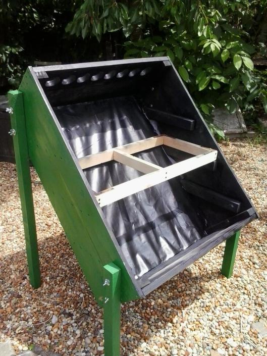 To protect the box and contents from the rain, I painted the dehydrator with some left over green paint on the outside and black paint on the inside. The dehydrator legs, trays and tray supports were constructed as per the plans, from the above link, with leftover 5cm x 5cm wood for the legs, 3cm x 5cm wood for the try supports and 2cm x 5cm wood for the trays. This photo shows a newly built tray being test fitted before it is also painted black. The only thing I bought was screen for the trays (I had some already, but not very much and what I did have was used to cover the round end holes at each end of the dehydrator box).